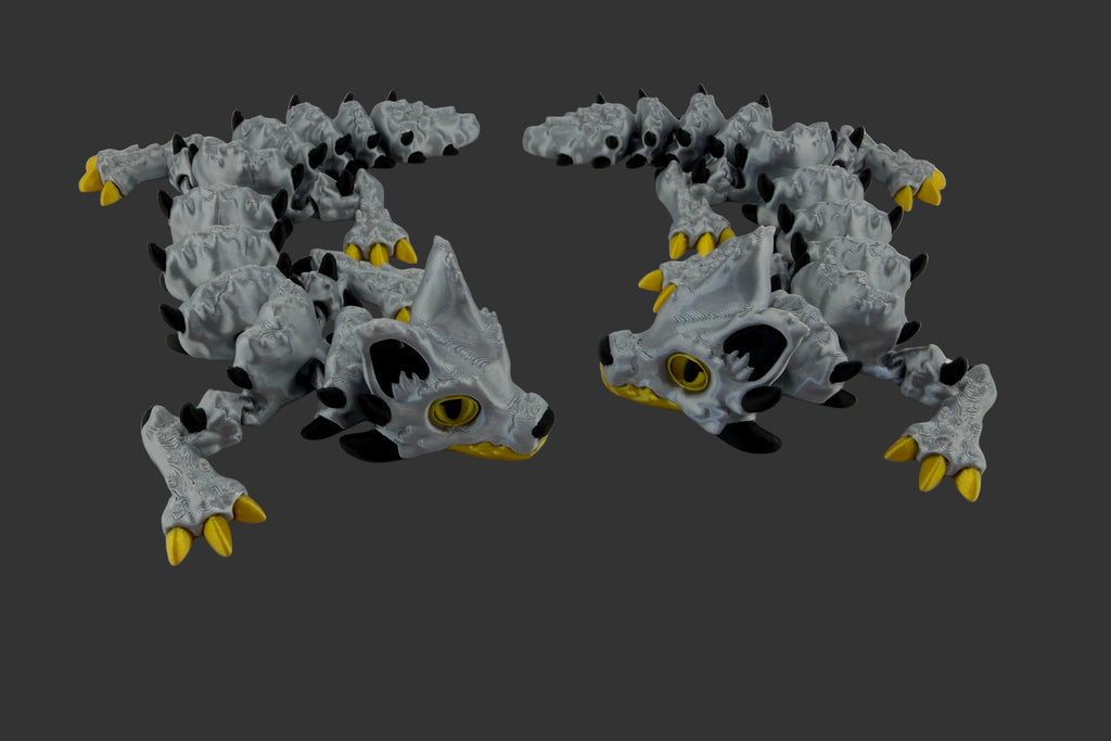 two 3D printed baby Husky Dragon-grey, black, and yellow