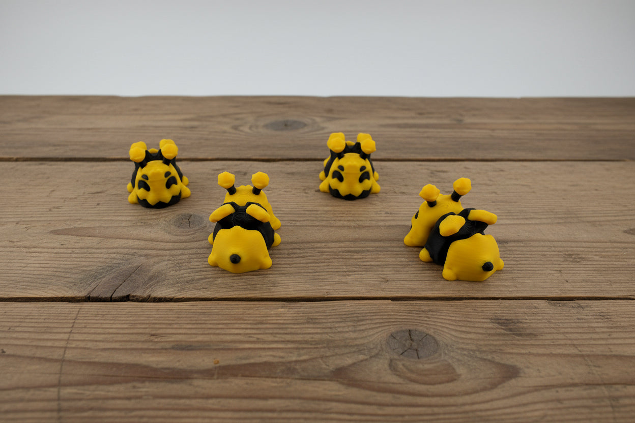 3D printed mini bees on farm table